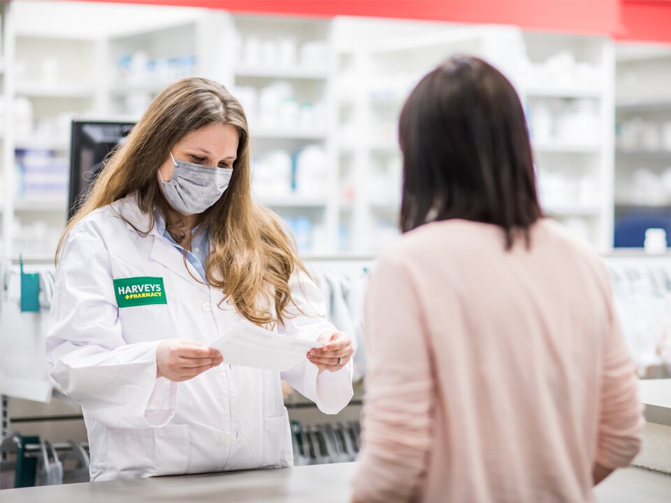 Harveys Pharmacy - Pharmacist assisting customer