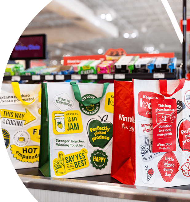 SE Grocers community bags on a conveyor belt.