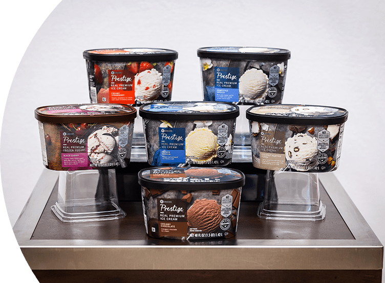 48 oz SE Grocers ice cream tubs of various flavors placed on a table.