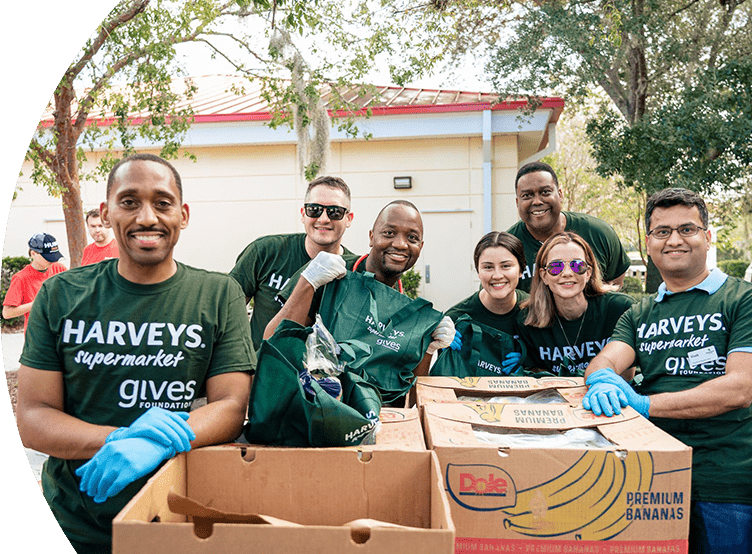 Group of Harveys Supermarket gives Foundation volunteers smiling