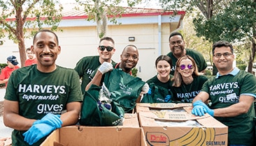 Group of Harveys Supermarket gives Foundation volunteers smiling
