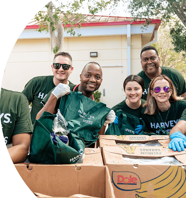 Group of Harveys Supermarket gives Foundation volunteers smiling