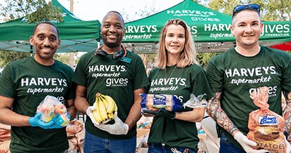Group of Harveys Supermarket Give Foundation volunteers assisting with donations.