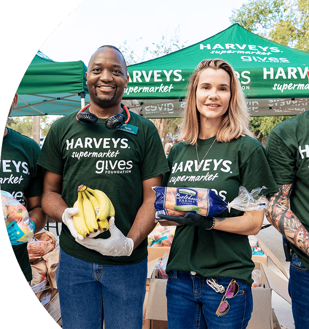 Group of Harveys Supermarket Give Foundation volunteers assisting with donations.