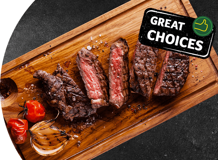 Cooked meat cut into pieces placed on a wooden board. 