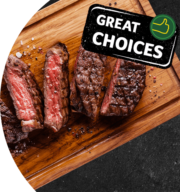 Cooked meat cut into pieces placed on a wooden board. 