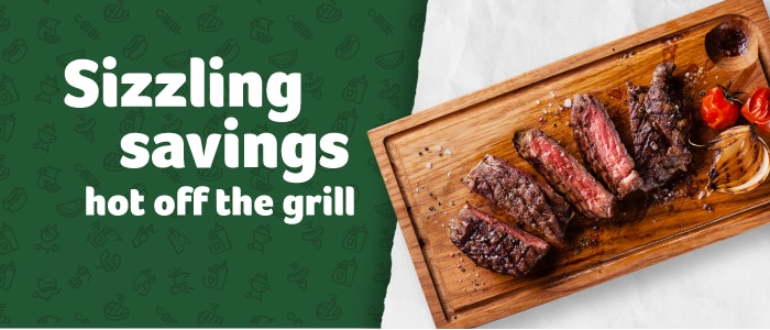 Green background featuring icons of grilling items and the text 'Sizzling savings hot off the grill' next to a wooden board with grilled steak slices, onions, and peppers.